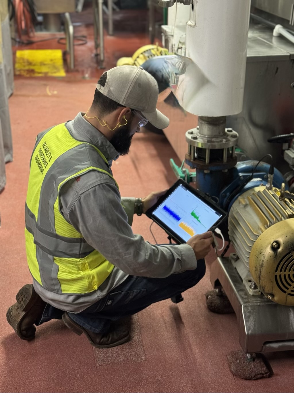 Vibration analysis technician testing industrial equipment